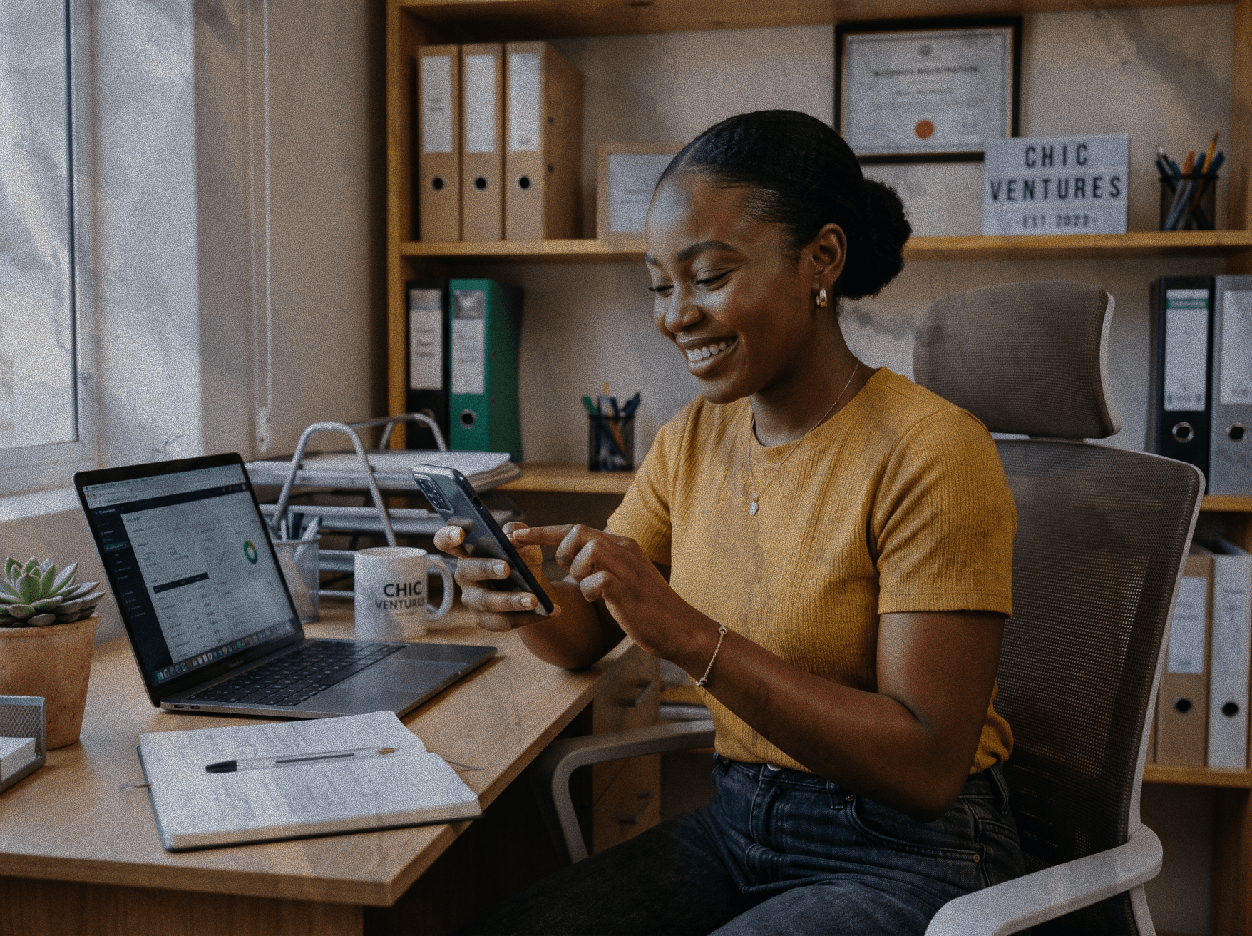 Business owner smiling at desk